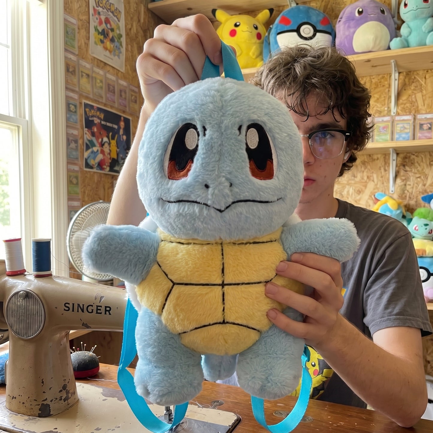 Squirtle plush backpack held in hands